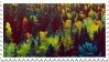 A stamp featuring a yellow and green forest shown from above the trees